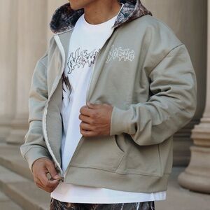 Tan jacket with light camo hood